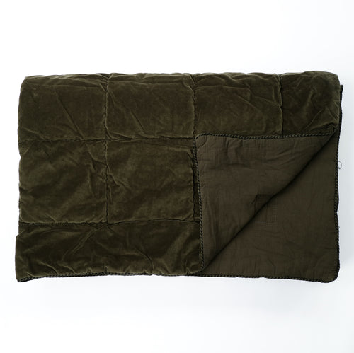 When you want to transform your bedroom into a  luxury retreat we have it covered with the beautiful Olive Green Throw by Raine & Humble. It is super thick and the colour is striking in the velvet material. Features a square quilted effect with a cotton trim.